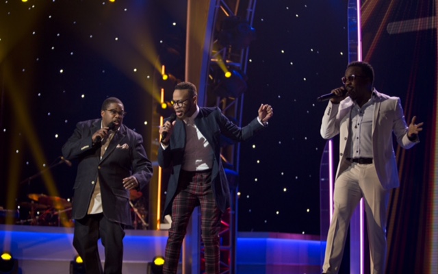 DeWayne Woods performing with group on stage