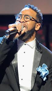 DeWayne Woods performing with microphone